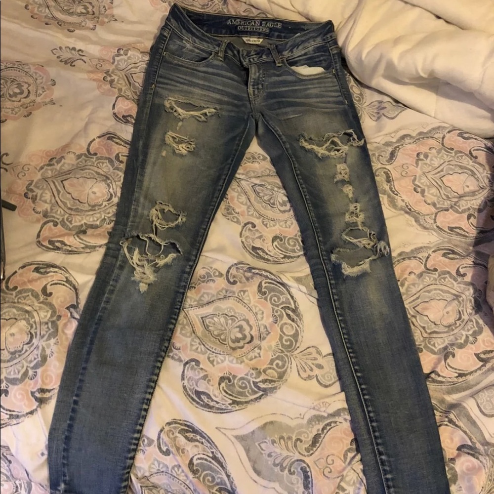 Distressed light blue washed jeans from Ae